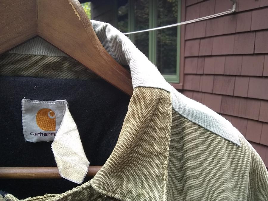 closeup front view of collar and shoulder patches on Carhartt jacket