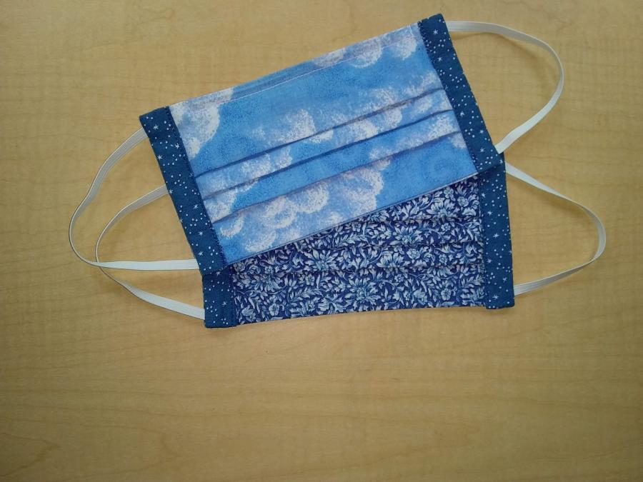 pleated face masks with elastic ear loops in contrasting blue fabric