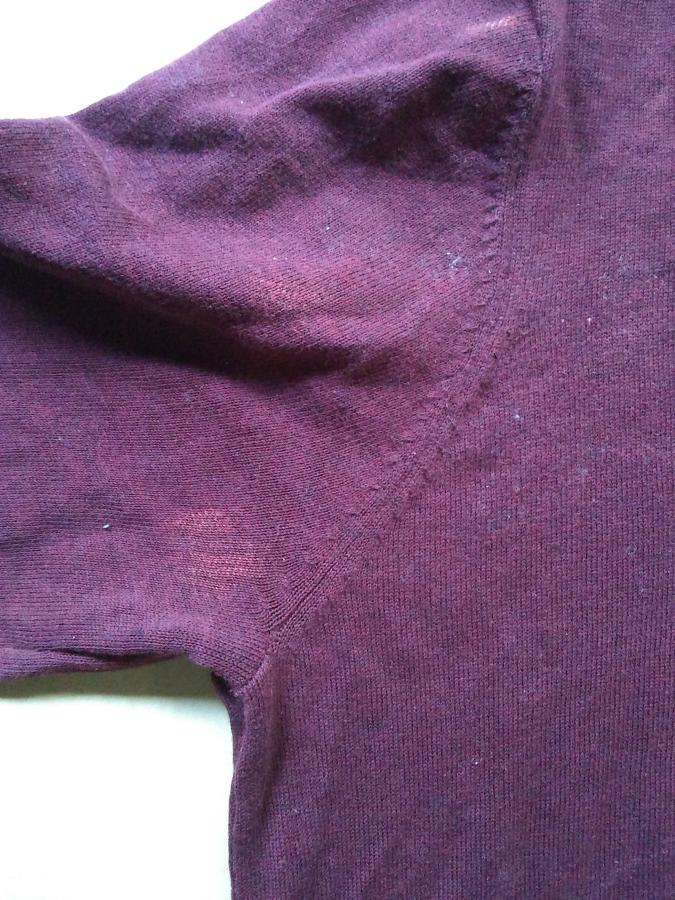 closeup of armpit of maroon sweater with no holes