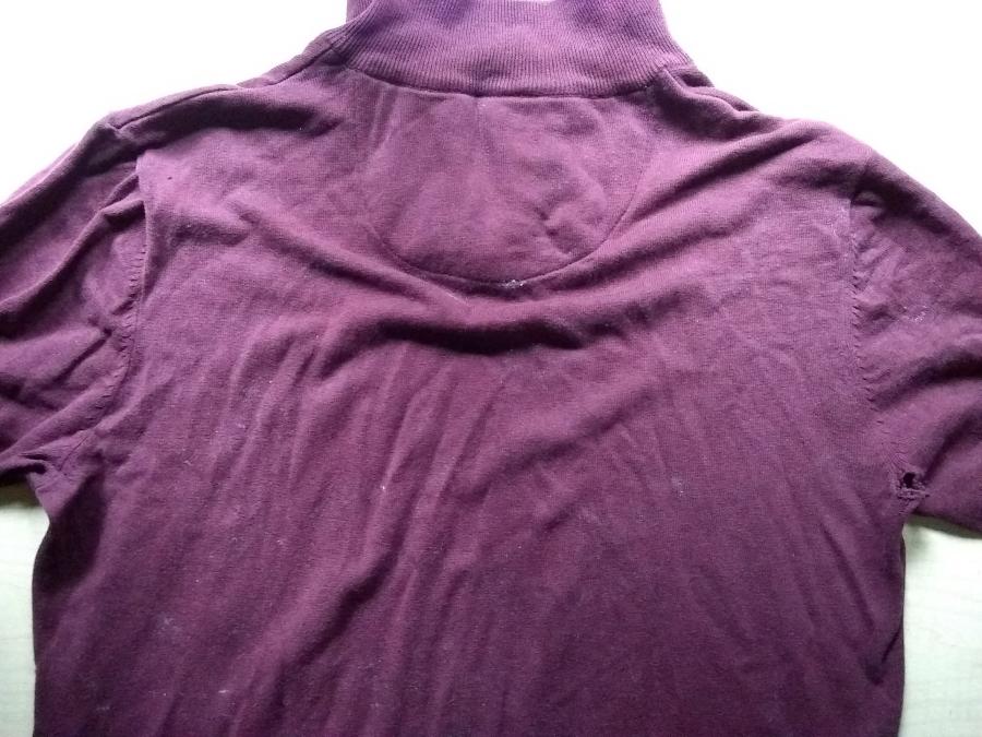 back of top of maroon sweater showing holes in armpit