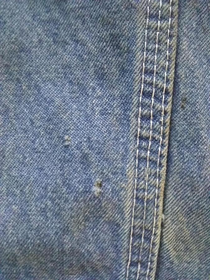 closeup of hole in blue jeans