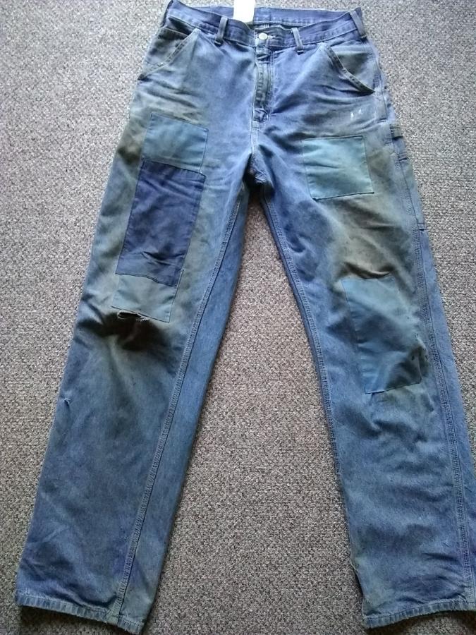 Blue jeans with patches and holes