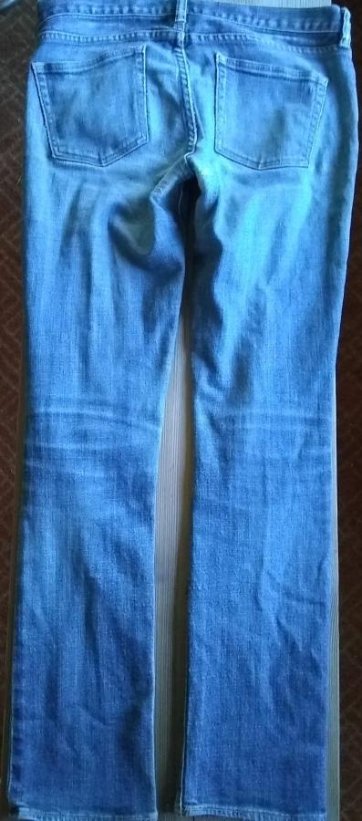 back full view of patched and machine darned jeans