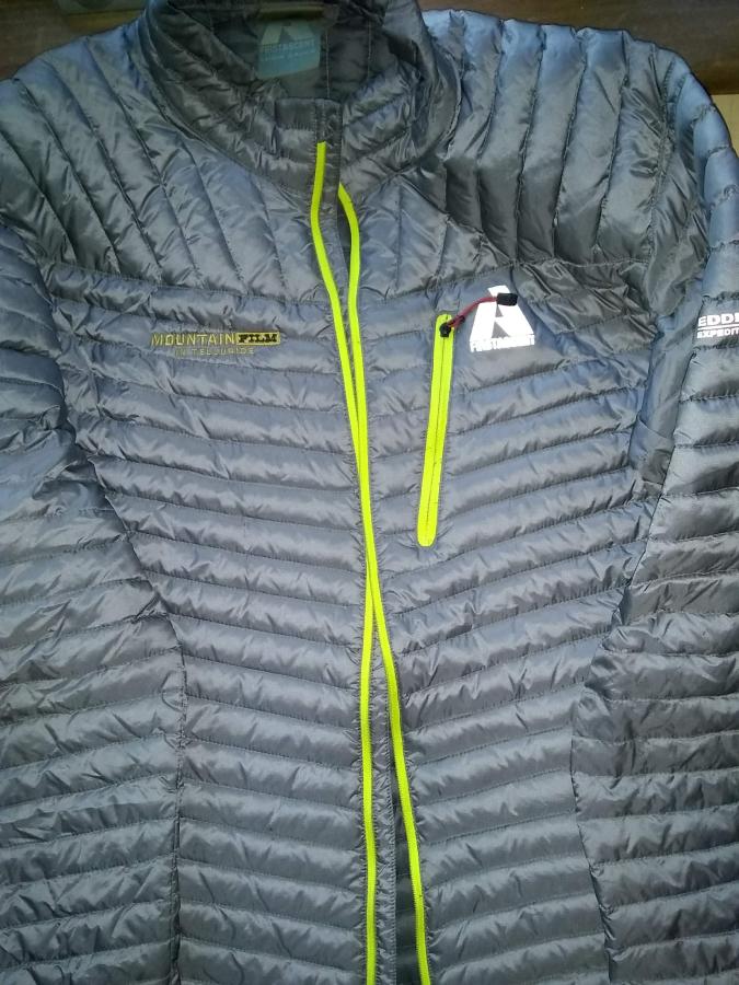 gray down jacket with broken (open) yellow zipper