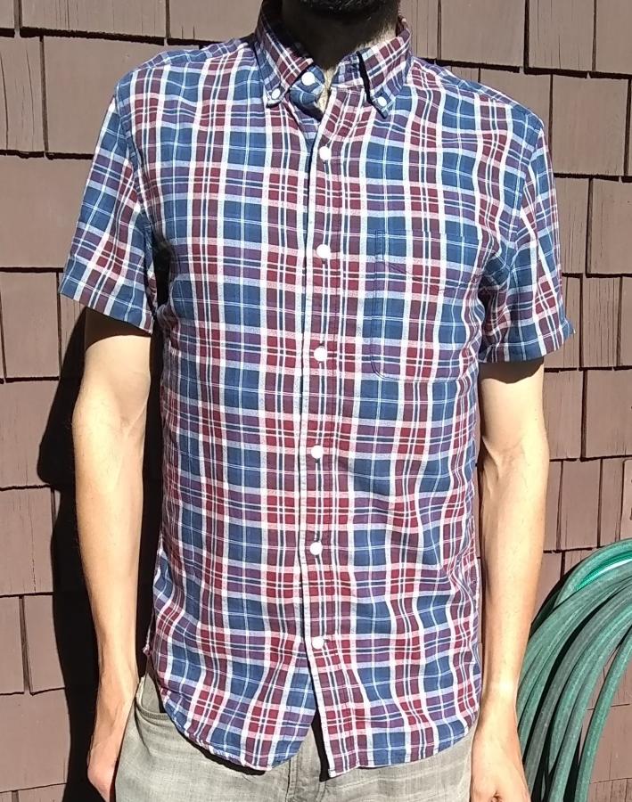 front view of short sleeve plaid shirt, worn by man