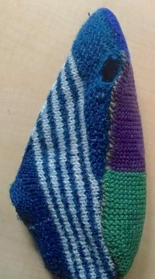 knitted slipper with patches but new hole in the toe
