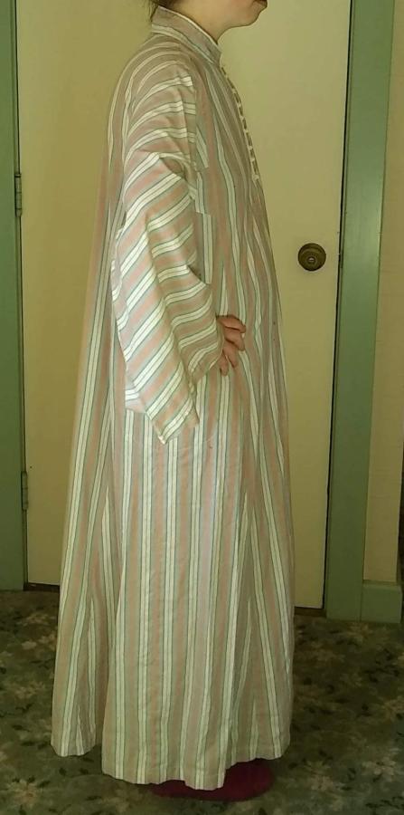 side view of woman wearing striped kaftan