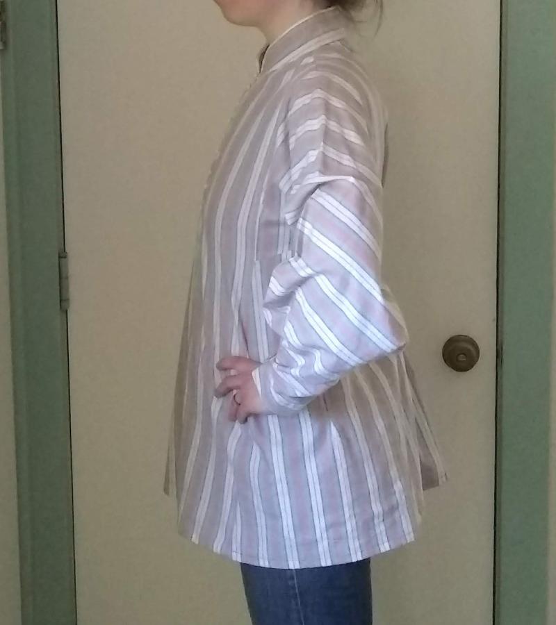 side view of woman wearing slightly fitted striped woven shirt