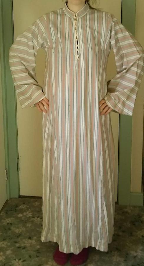 front view of woman wearing striped kaftan