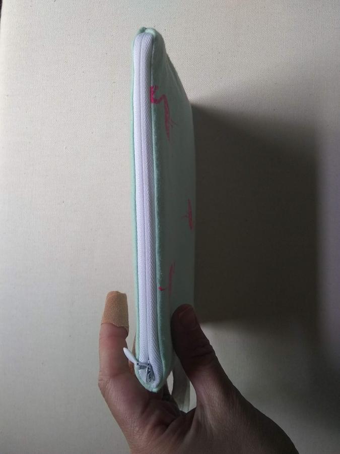 top view of wristlet, showing zipper, closed