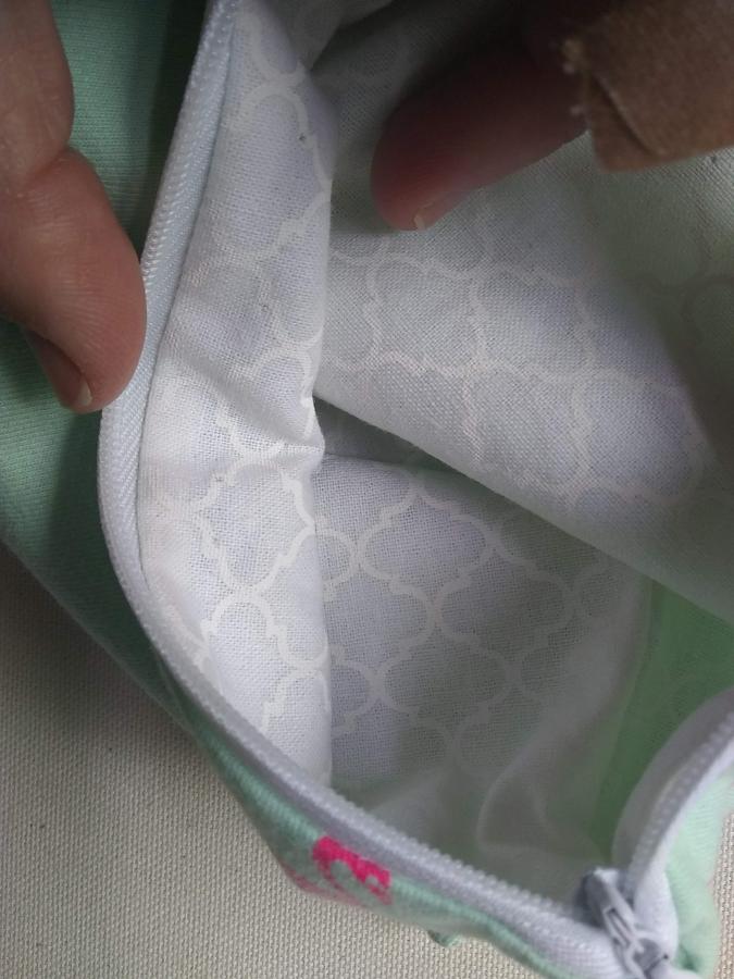 closeup of wristlet showing inside and white lining