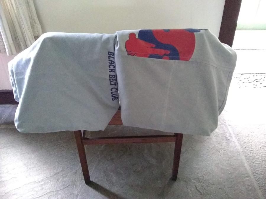 Gray flat bottomed bags draped over a chair