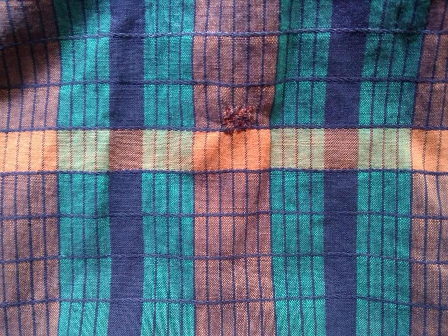 plaidish fabric with orange darn