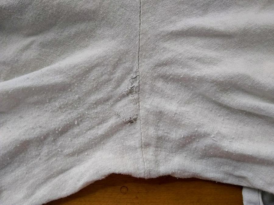 crotch/seat of linen pants showing holes/worn fabric and pilling