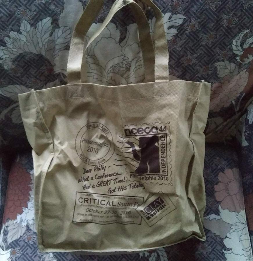 Beige tote bag with lots of logos - front side