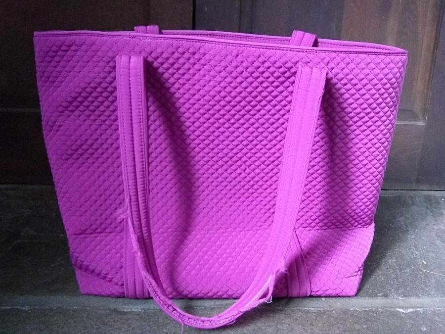 Pink tote bag with frayed handles