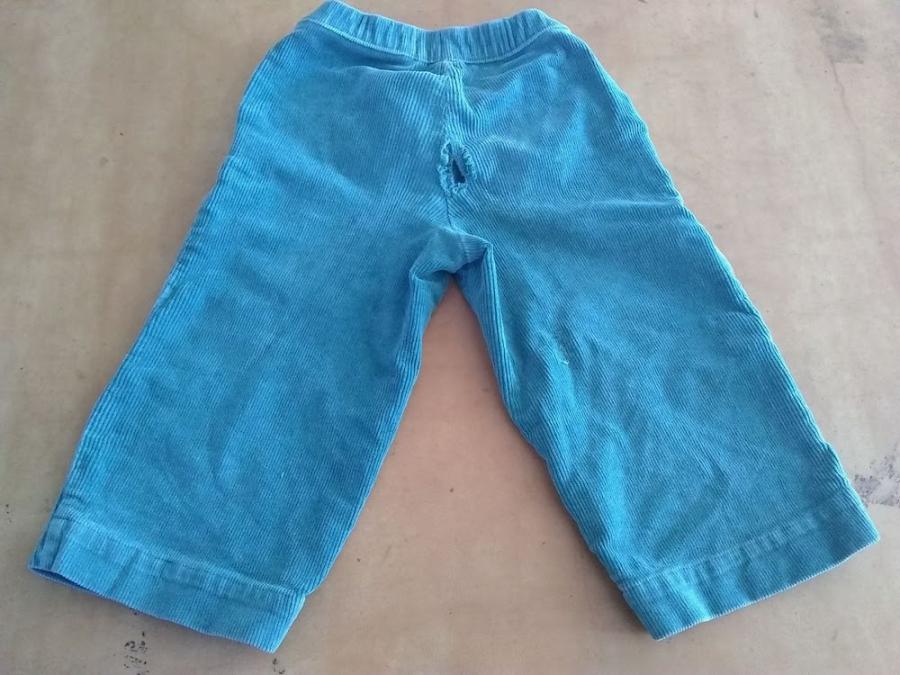 Blue corduroy pants with holes in the seat