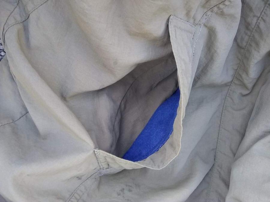 Jacket pocket, showing a peek into the blue lining of pocket